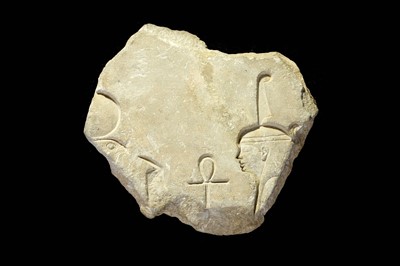 Lot 55 - AN EGYPTIAN LIMESTONE RELIEF FRAGMENT Late...