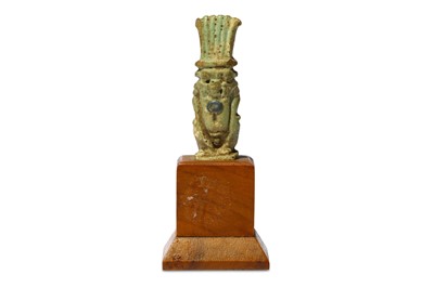 Lot 40 - AN EGYPTIAN GLAZED COMPOSITION BES AMULET Late...