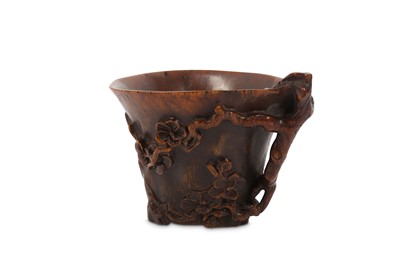 Lot 285 - A CHINESE RHINOCEROS HORN 'PRUNUS' CUP.  17th...