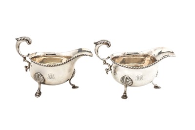 Lot 228 - A pair of Edwardian sterling silver sauceboats,...