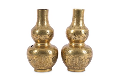 Lot 198 - A pair of Chinese bronze double gourd vases,...