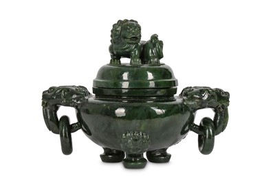 Lot 749 - A LARGE CHINESE SPINACH JADE ‘LION DOG’...