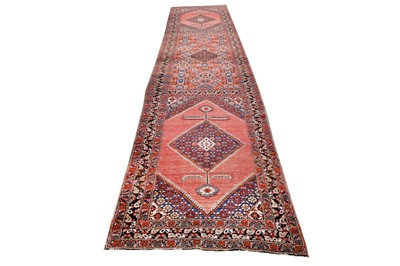 Lot 27 - AN ANTIQUE NORTH-WEST PERSIAN RUNNER...