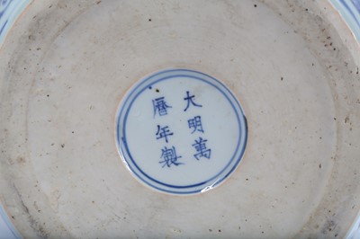 Lot 248 - A CHINESE BLUE AND WHITE REVERSE-DECORATED...