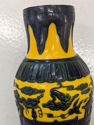 Lot 190 - A PAIR OF CHINESE BLUE OVERLAY YELLOW-GROUND BEIJING GLASS VASES
