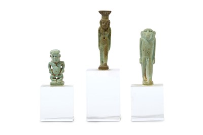 Lot 175 - THREE EGYPTIAN GLAZED COMPOSITION AMULETS Late...