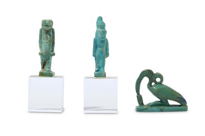 Lot 176 - THREE EGYPTIAN GLAZED COMPOSITION AMULETS Late...