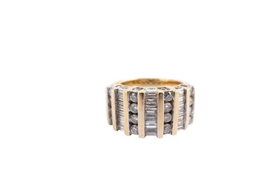 Lot 57 - A diamond dress ring, Set with alternating...