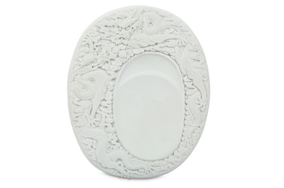 Lot 6 - A CHINESE WHITE BISCUIT 'DRAGON' INKSTONE.