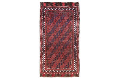 Lot 3 - AN ANTIQUE BALOUCH RUG, NORTH-WEST PERSIA...