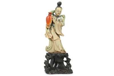 Lot 414 - A CHINESE STAINED SOAPSTONE 'IMMORTAL MAIDEN'...