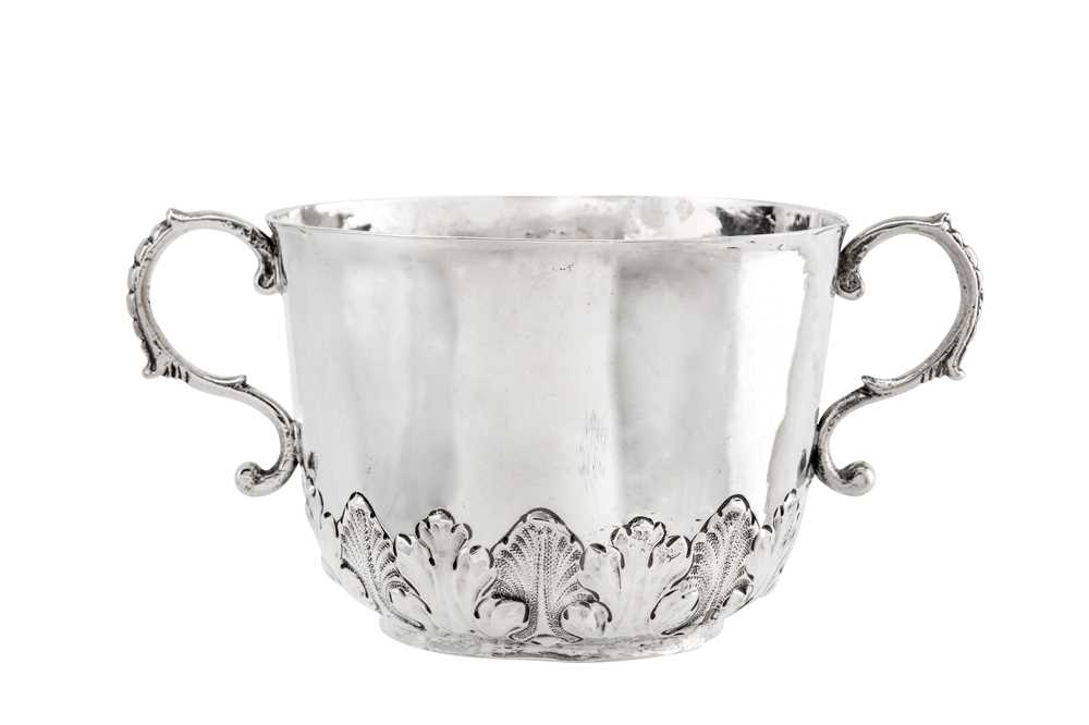 Lot 329 - A Charles II sterling silver twin handled...