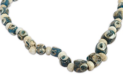 Lot 90 - AN EYE BEAD NECKLACE Formed of opaque blue and...