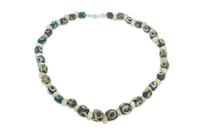 Lot 90 - AN EYE BEAD NECKLACE Formed of opaque blue and...