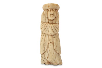 Lot 1040 - A BONE NETSUKE OF A MERCHANT. Edo period....