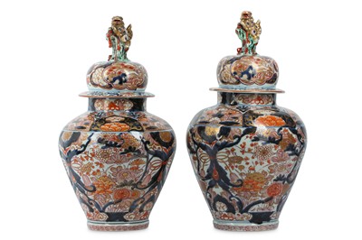 Lot 1045 - A PAIR OF IMARI VASES AND COVERS. Circa 1700....