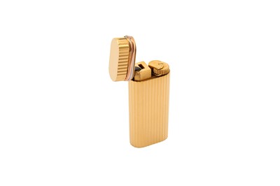 Lot 280 - A Cartier gold plated Trinity lighter, with...