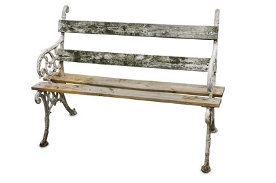 Lot 325 - A cast iron two seater garden bench, the white...