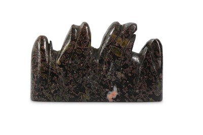 Lot 658 - A CHINESE DREAMSTONE BRUSH REST. Carved with...