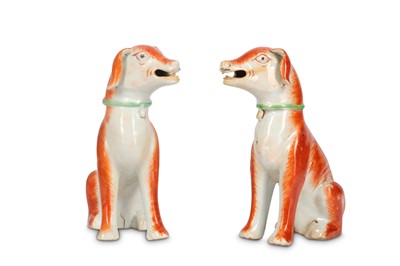 Lot 476 - A PAIR OF CHINESE FAMILLE ROSE HOUNDS. Qing...