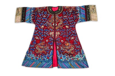 Lot 169 - A CHINESE RED-GROUND ‘DRAGON’ ROBE. Late Qing...