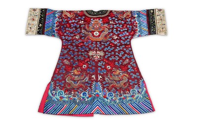 Lot 169 - A CHINESE RED-GROUND ‘DRAGON’ ROBE. Late Qing...