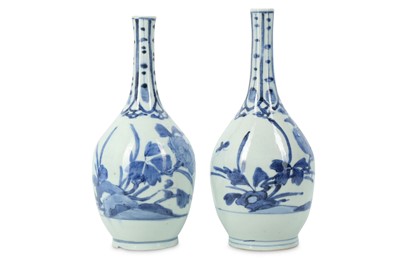 Lot 1038 - A PAIR OF IMARI SAKE BOTTLES. 17th Century....