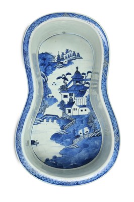 Lot 586 - A CHINESE BLUE AND WHITE BIDET.  Qing Dynasty,...