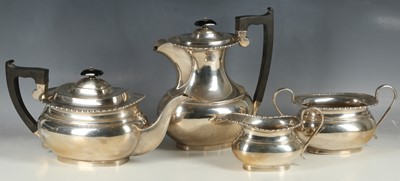 Lot 241 - A hallmarked silver four piece tea set of...