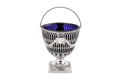 Lot 319 - A George III sterling silver sugar basket,...