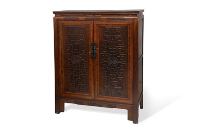 Lot 619 - A CHINESE HUAMU-INSET HONGMU CABINET. Qing...