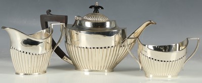 Lot 242 - A hallmarked silver three piece tea set (two...