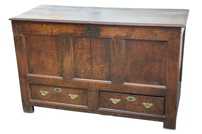 Lot 300 - An 18th Century oak mule chest, the plank top...