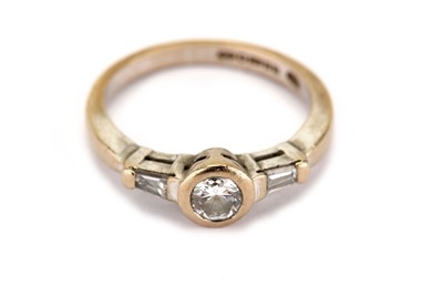 Lot 320 - A diamond single-stone ring, the collet-set...