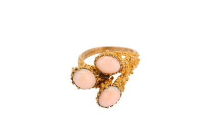Lot 394 - A gold and coral dress ring, 1972, the...