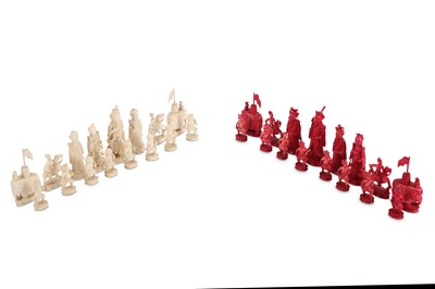 Lot 214 - A late 19th century carved ivory chess set,...