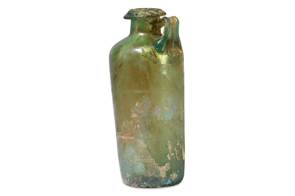 Lot 138 - A ROMAN GREEN GLASS JUG Circa 2nd - 3rd...