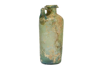 Lot 138 - A ROMAN GREEN GLASS JUG Circa 2nd - 3rd...