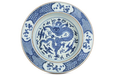 Lot 161 - A CHINESE BLUE AND WHITE ‘DRAGON’ BASIN. Qing...