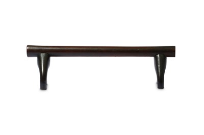 Lot 239 - A WOOD HEADREST With a dark, polished patina,...