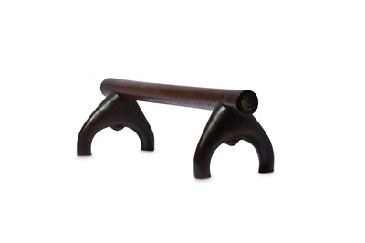 Lot 239 - A WOOD HEADREST With a dark, polished patina,...