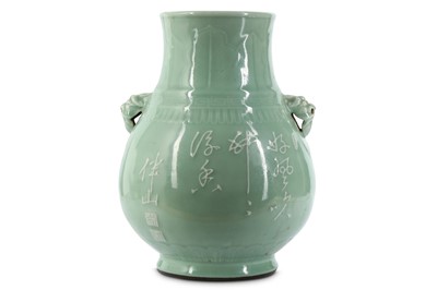 Lot 778 - A CHINESE SLIP-DECORATED ARCHAISTIC CELADON...