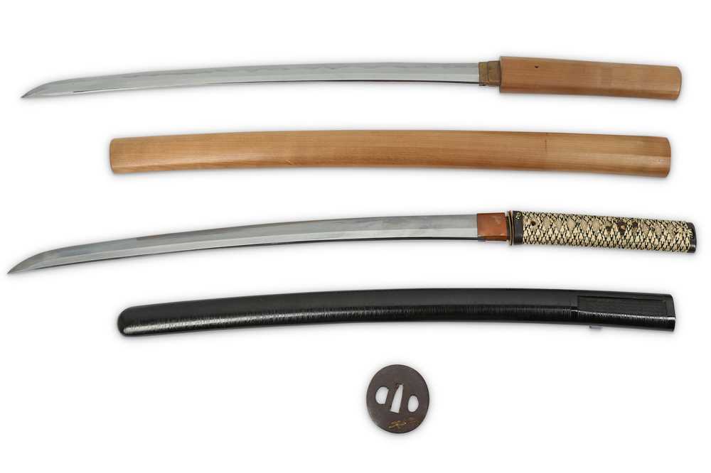 Lot 989 - TWO WAKIZASHI AND A TSUBA. The blade of...