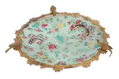 Lot 207 - An Oriental Celadon porcelain dish, painted in...