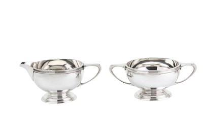 Lot 244 - A George VI sterling silver three-piece tea...
