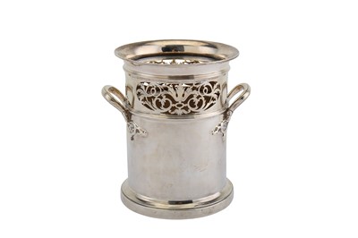 Lot 226 - A George V sterling silver twin handled bottle...