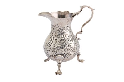 Lot 201 - A George III sterling silver cream jug, London...