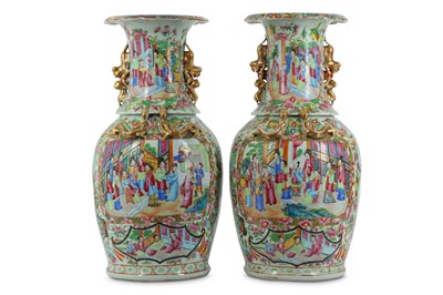 Lot 787 - A PAIR OF FAMILLE ROSE CANTON VASES. Qing...