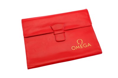 Lot 393 - OMEGA. An official red leather Omega wallet...
