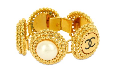 Lot 774 - Chanel Pearl and CC Bracelet, 1970s, simulated...